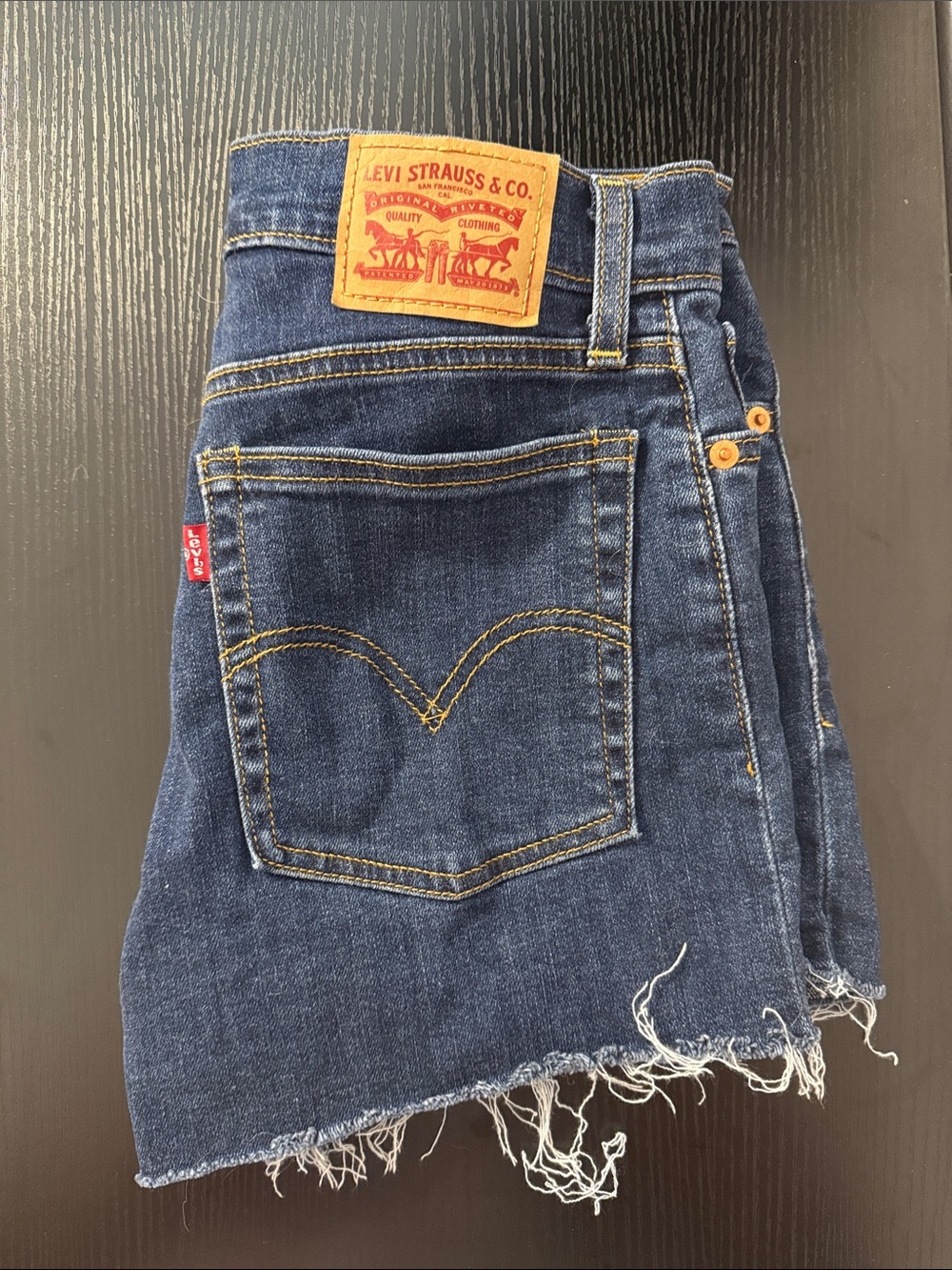 Levi’s Dark Wash Stretch Raw Hem Denim Shorts